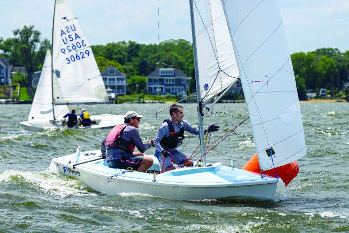 dinghy sailors round mark