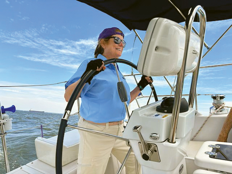 Steering at the helm of a sailboat Steering at the helm of a sailboat